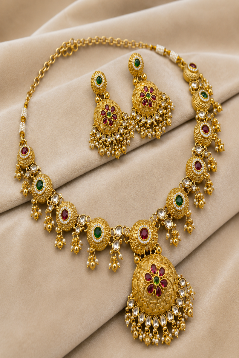 Gold Kundan Necklace Set with Floral Pendant, Ruby & Green Stone Design