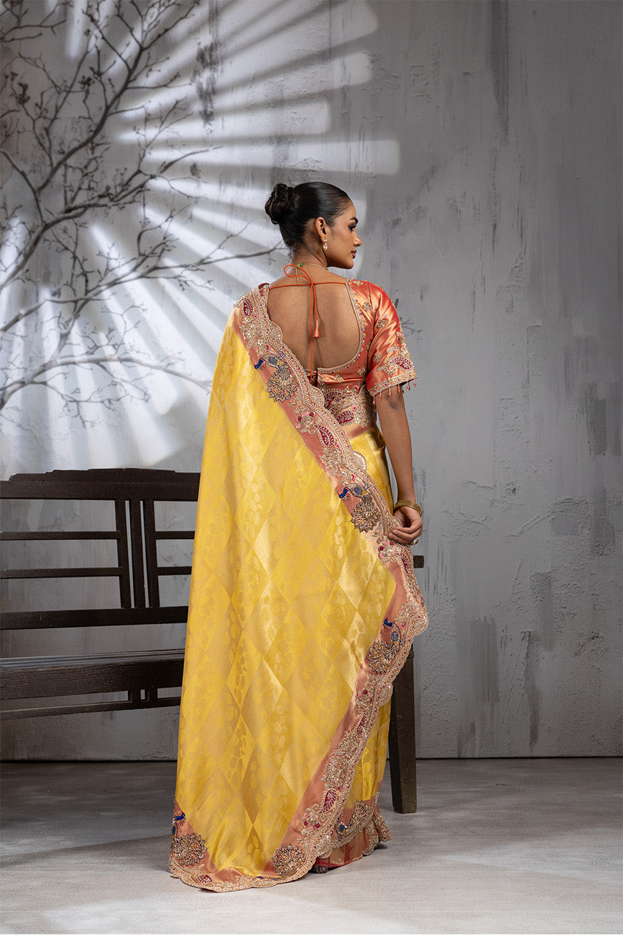Yellow Banarasi Organza Saree with Pink Border and Multicolor Zari Embroidery