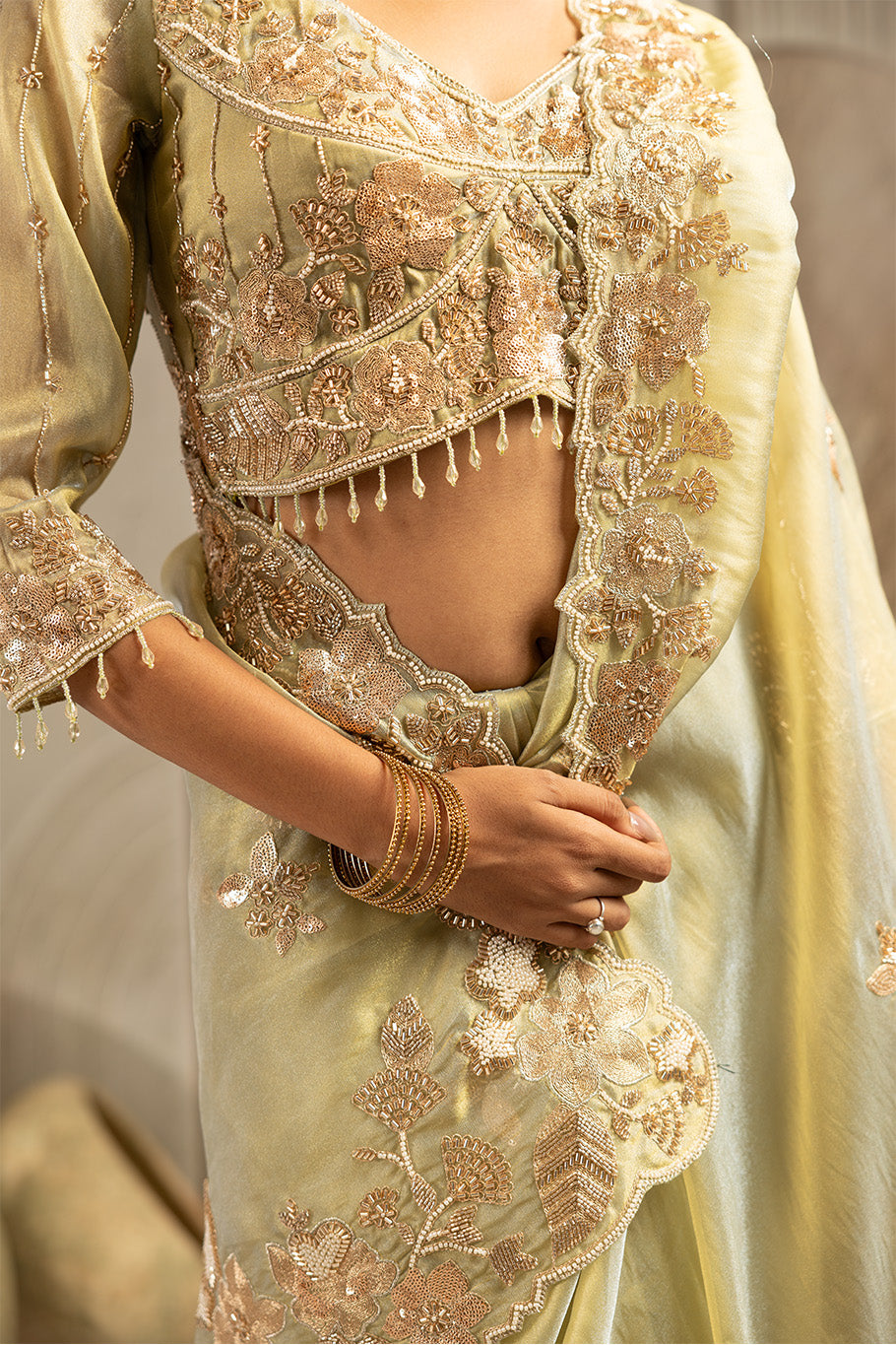 Pista Green Organza Silk Saree with Golden Zari Embroidery