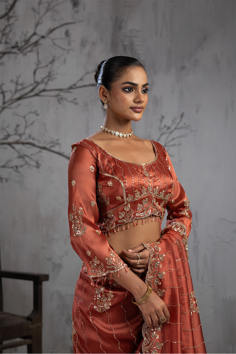 Rusty Orange Organza Silk Saree with Golden Floral Embroidery