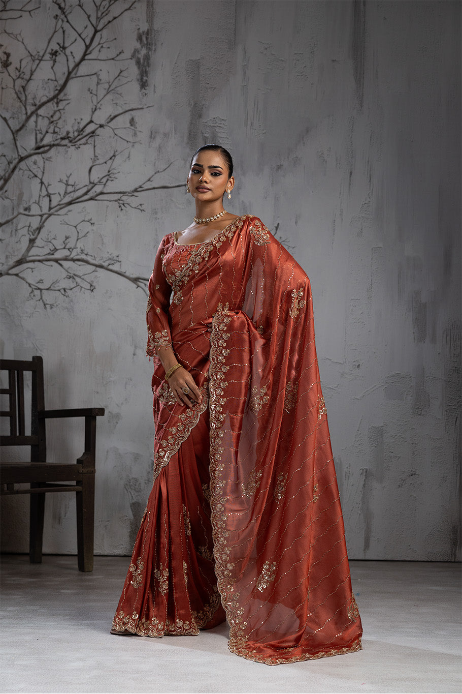 Rusty Orange Organza Silk Saree with Golden Floral Embroidery
