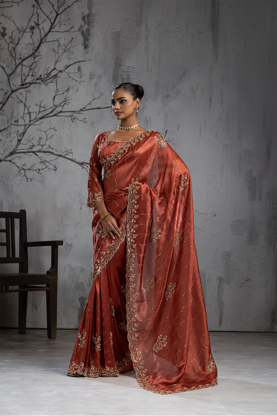 Rusty Orange Organza Silk Saree with Golden Floral Embroidery