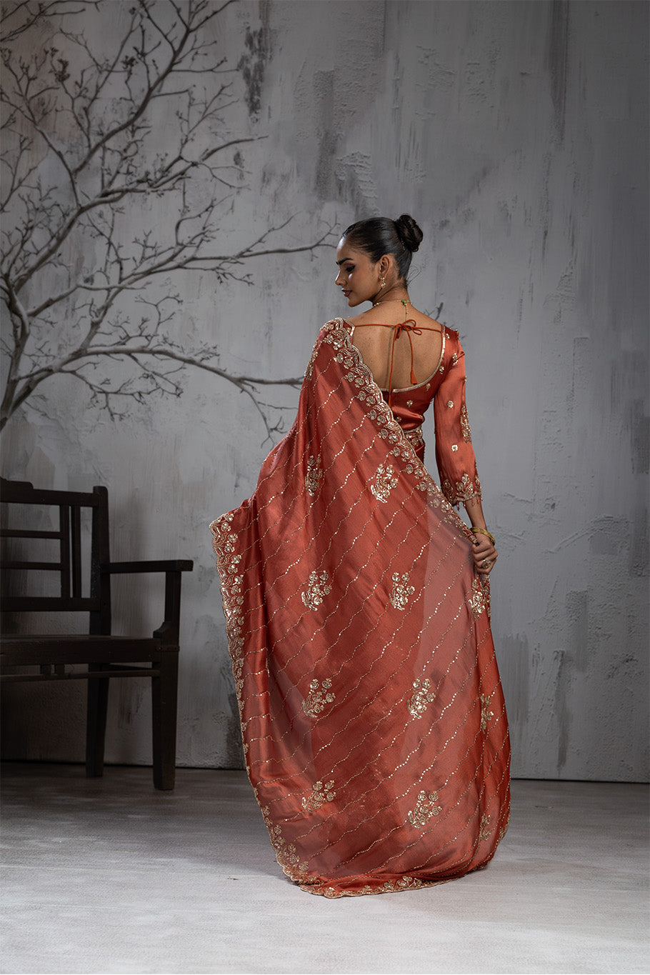 Rusty Orange Organza Silk Saree with Golden Floral Embroidery
