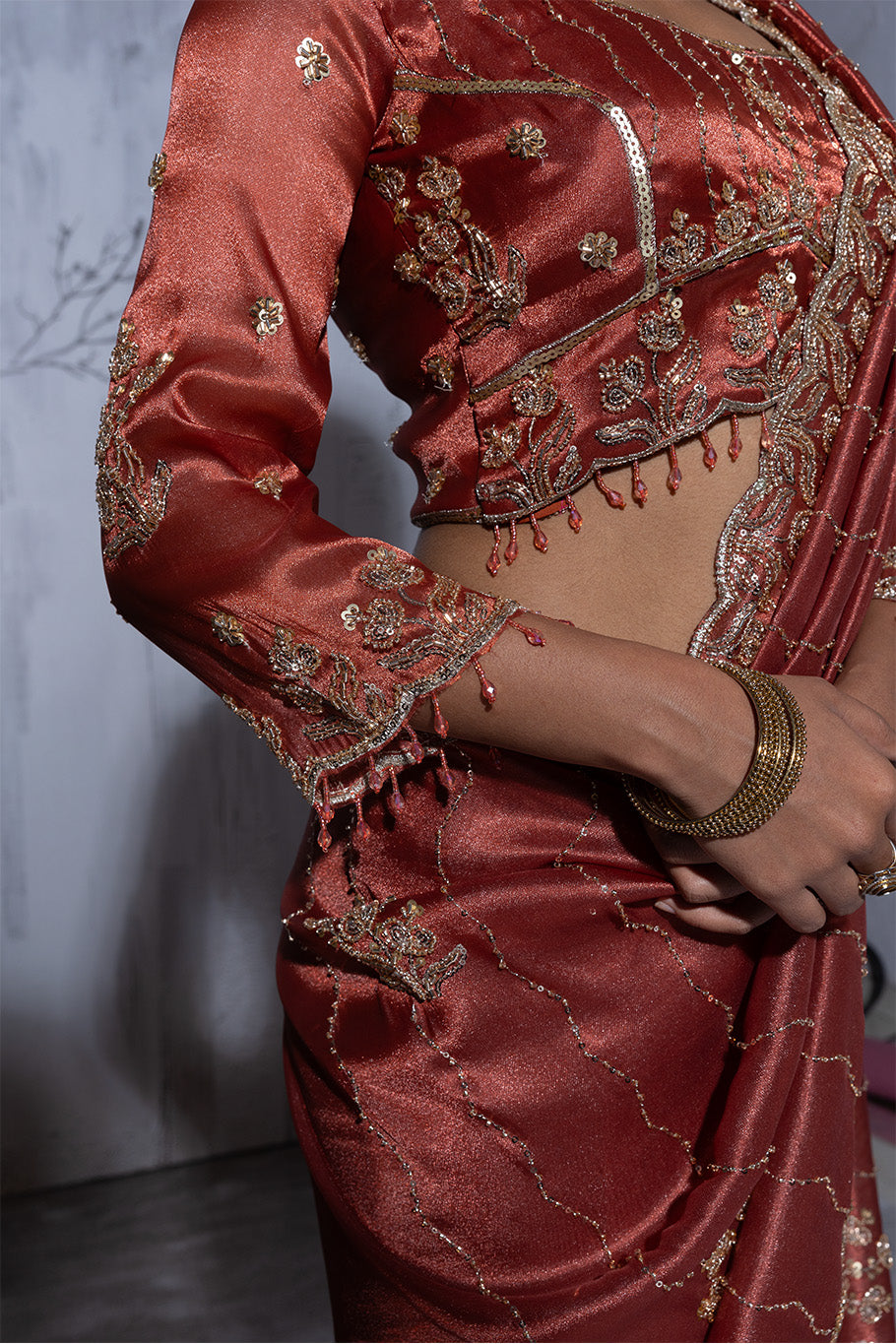 Rusty Orange Organza Silk Saree with Golden Floral Embroidery