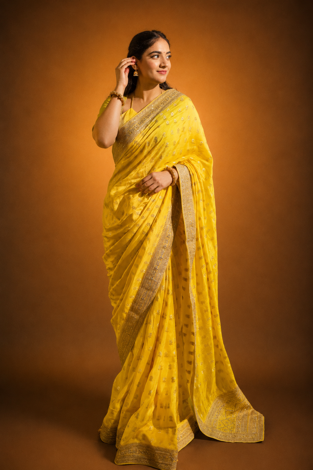 Yellow Silk Saree with Golden Buti Work and Rich Zari Border