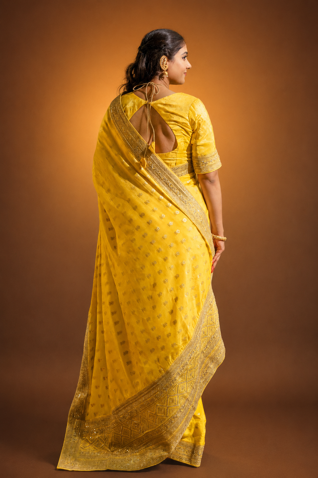 Yellow Silk Saree with Golden Buti Work and Rich Zari Border