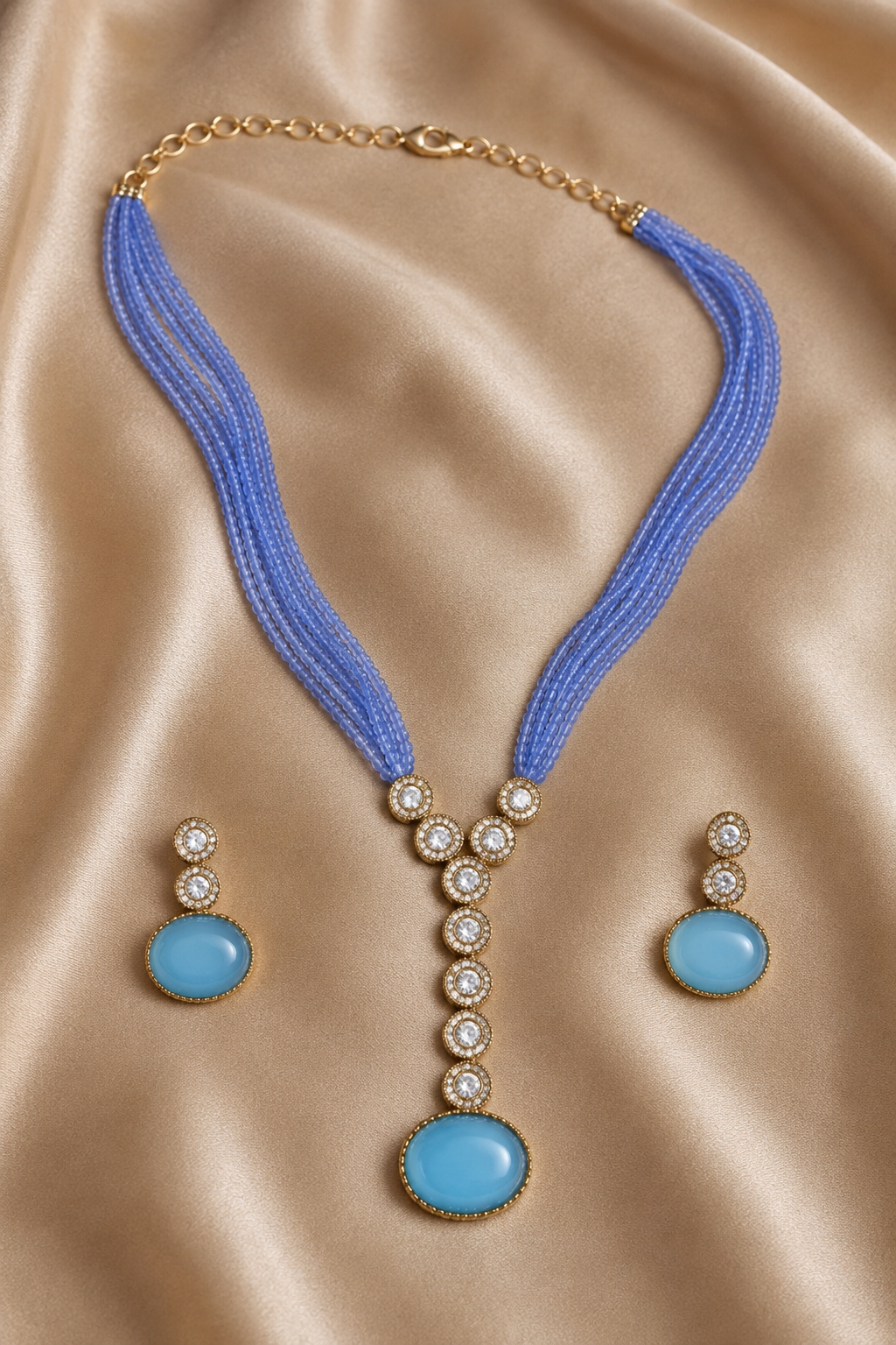 Sky Blue Multi-Strand Beaded Necklace with Antique Gold Oval Pendant & Matching Drop Earrings