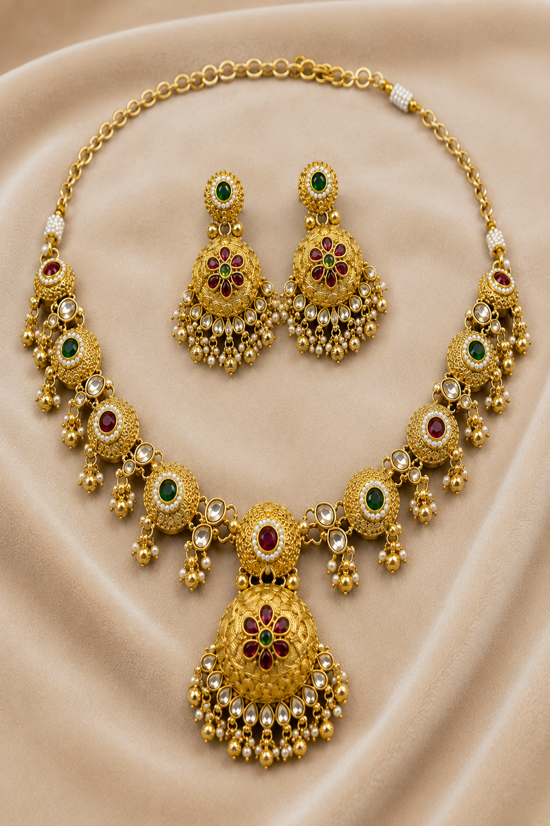 Gold Kundan Necklace Set with Floral Pendant, Ruby & Green Stone Design
